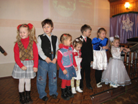 Kids recite Christmas poems at church Christmas celebration.